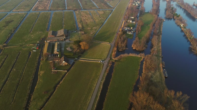 Aerial view of a car driving next the lake.