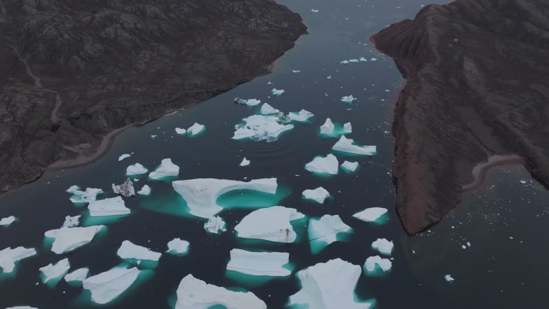 Aerial View of a big iceberg along the coast, Sermersooq, Greenland.