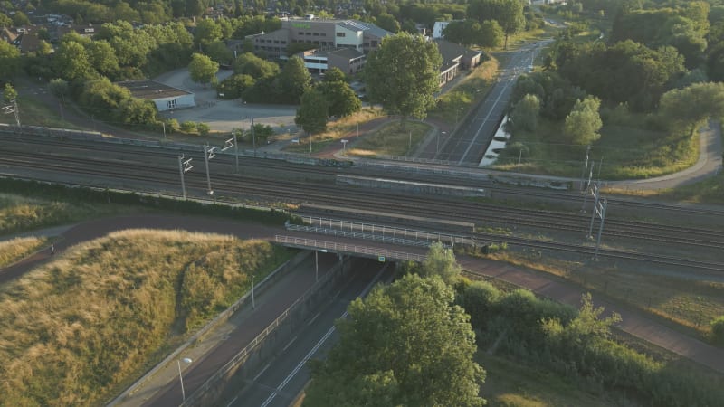 Aerial Overview of Dutch Road Network, rail/train tracks and bicycle lane in Summer in Houten