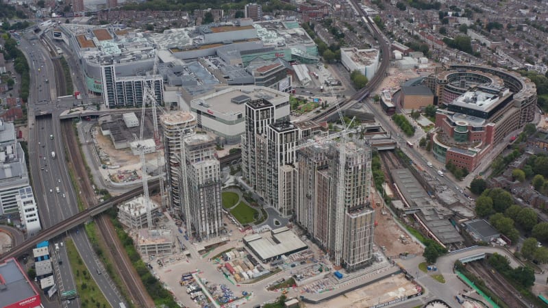 Building new residential complex. Developer project of tall residential buildings near huge shopping centre and transport infrastructure. London, UK