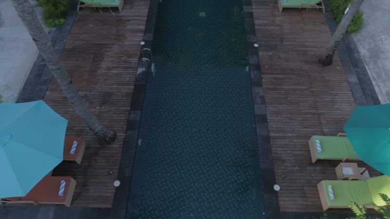 Aerial view of swimming pool between bungalow.