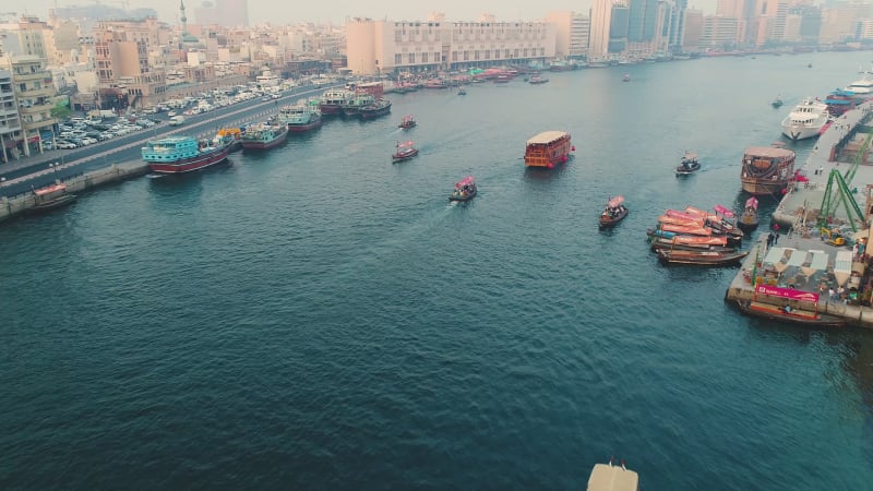 Aerial view of navigable river crossing suburbs.