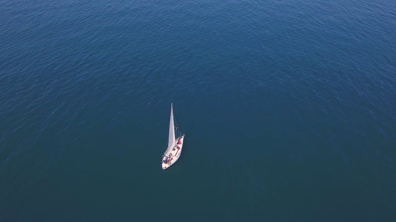 Aerial view of a boat sailing at Costa Brava.