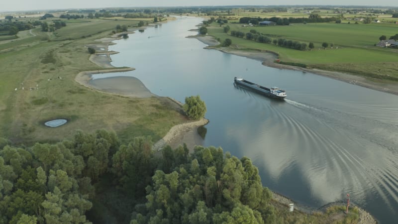 Cargo Boat Navigating River Lek in Tull en 't Waal, Netherlands