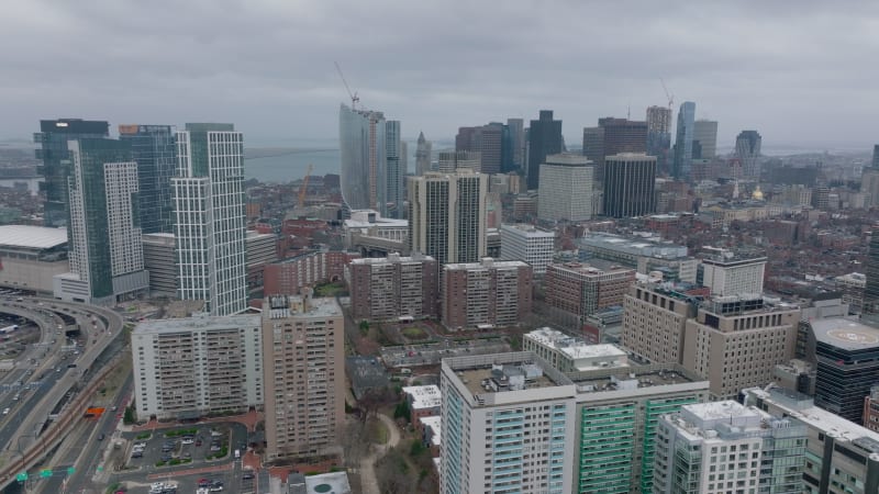 Various multistorey buildings in city. Aerial descending shot of residential or office development. Boston, USA