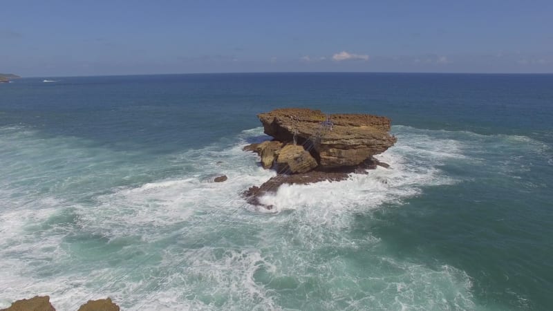 Aerial view cable car connecting isolate rock formation, Jogjakarta