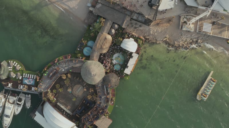 Scenic Top View of a Beach Festival location with people around pool in tropical Croatia, Aerial Overhead Birds Eye View