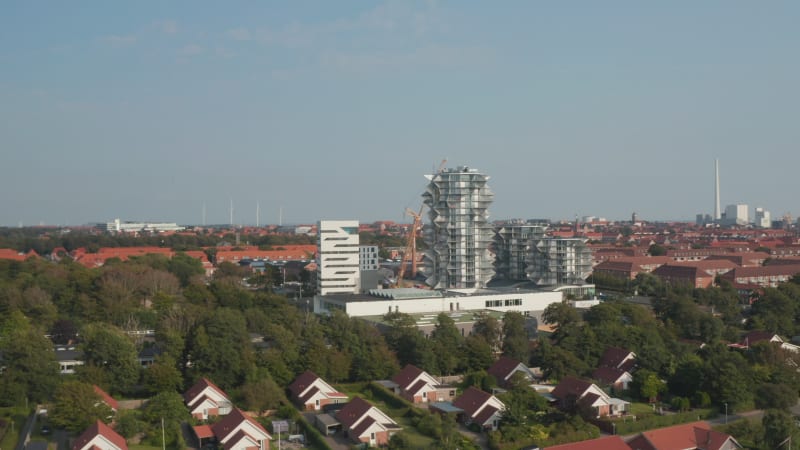 Bird's eye drone view of the construction of Esbjerg Tower, future students home and hotel apartments. Aerial view revealing the chimney of the power station