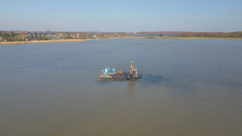 Excavator working in a lake