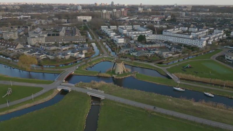 Typical Dutch wind mill near residential area