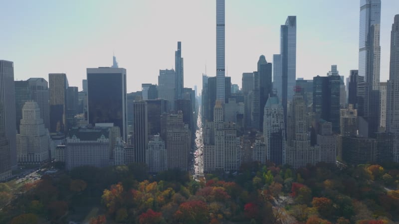 Aerial panoramic shot of majestic high rise building on south end on Central park. Autumn colour foliage on trees in park. Manhattan, New York City, USA