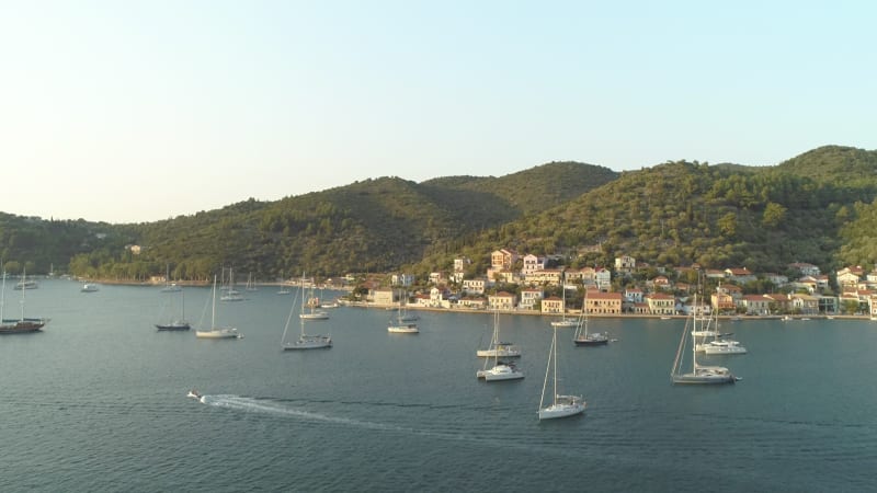 Aerial view of group of boats anchored.