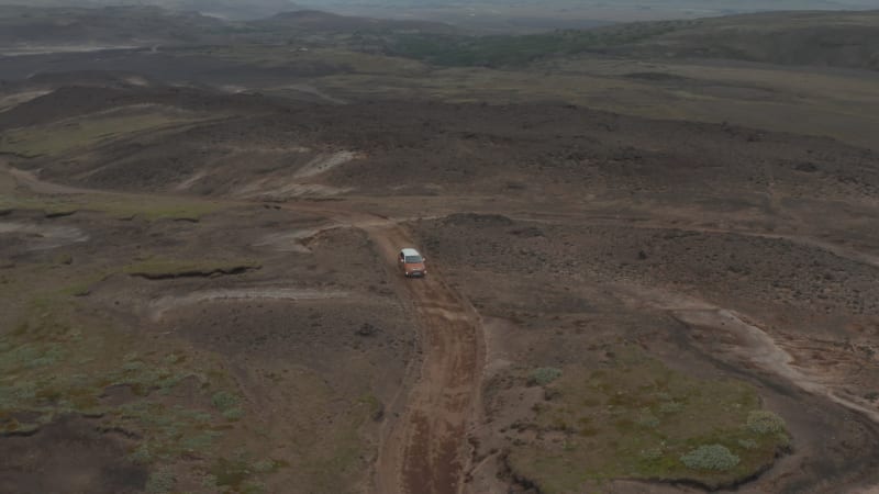 Aerial view car parked in desolate countryside off road in Iceland. Drone view of icelandic highlands with four by four parked for adventurous expedition