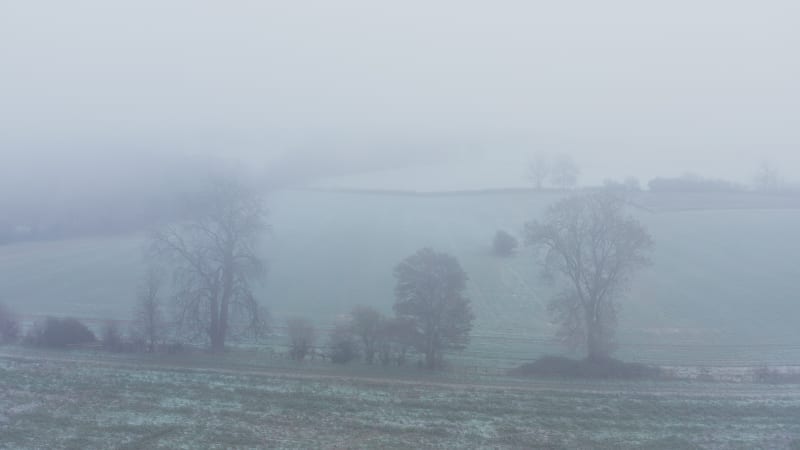 Aerial drone video of countryside and fields.