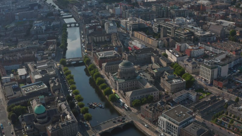 Aerial footage of court building complex at Liffey river. Slide and pan footage of town from height. Dublin, Ireland