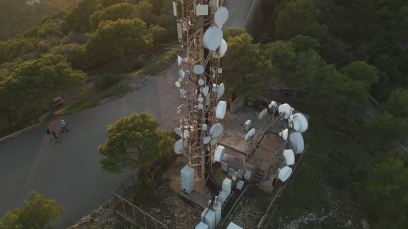 Overhead Perspective of Transmission Tower in Mallorca with Nearby Pedestrians