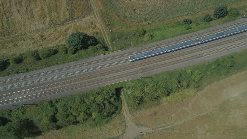 Birds Eye View of a Fast Commuter Train in the Countryside