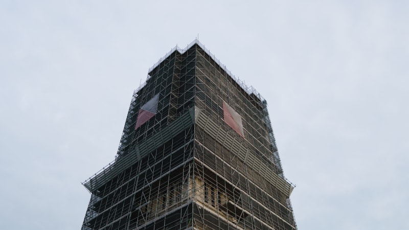 An aerial perspective captures the maintenance and restoration scaffolding the majestic Dom tower in the historic city of Utrecht.