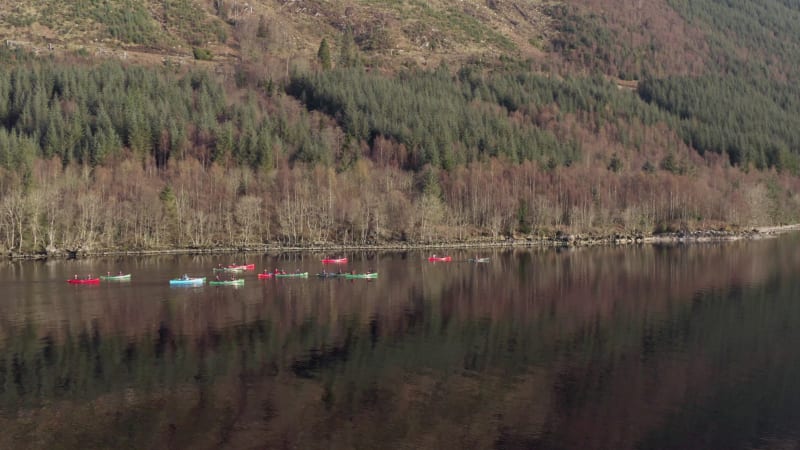 A Team of Canoeists Crossing a Lake in the Early Morning