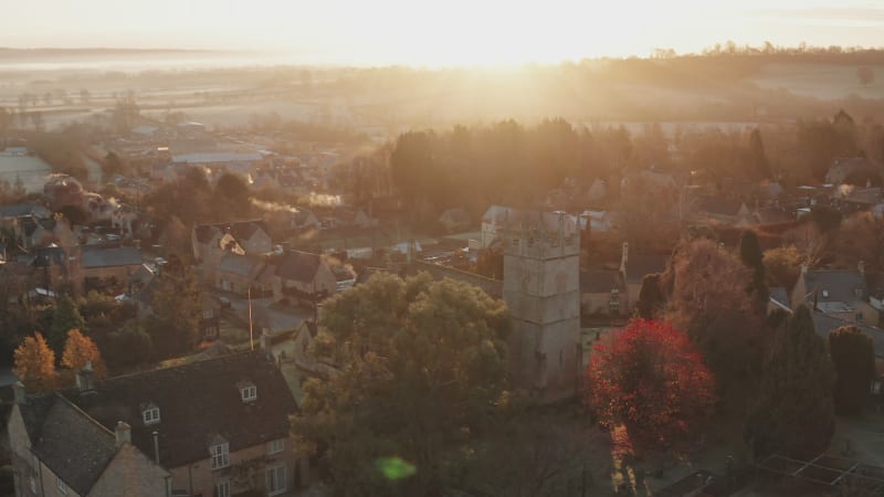 Typical English village and beautiful British countryside scenery in The Cotswolds showing a rural church at sunrise in morning sun at Longborough, Gloucestershire, England, UK