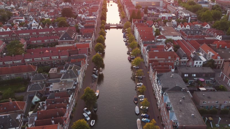 A water canal running through a residential area of Leiden, South Holland, Netherlands.