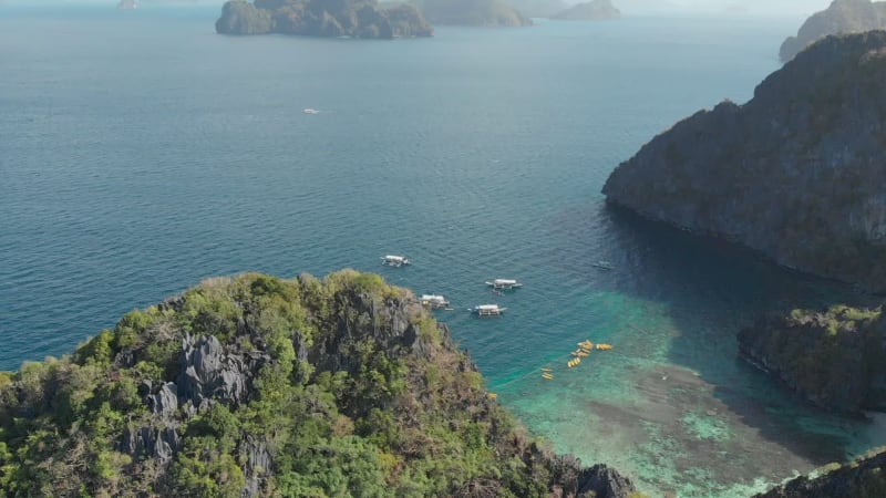 Aerial view of outrigger boats by Big Lagoon, El Nido