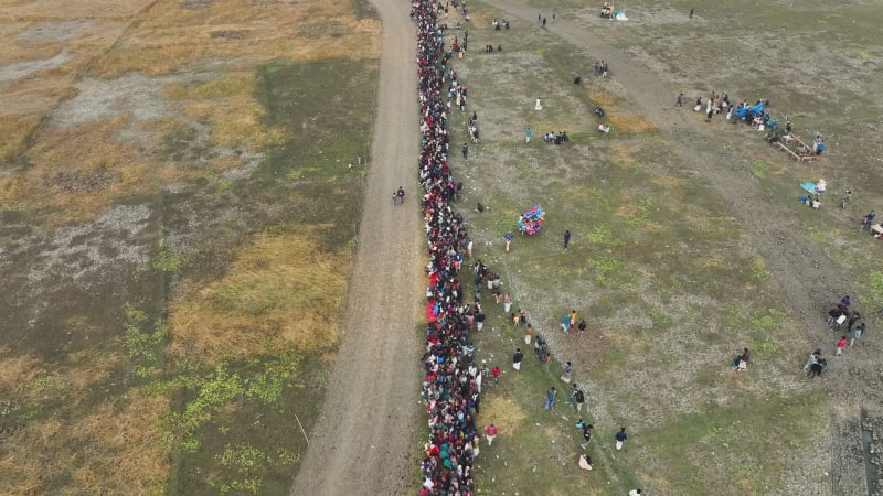 Aerial view of people watching horse race in Mohanpur, Bangladesh.