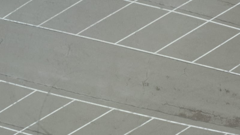 Aerial view of a Ferrari 308 GTI in a parking lot.