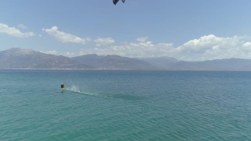 Aerial view of person jumping windsurfing at the Gulf of.