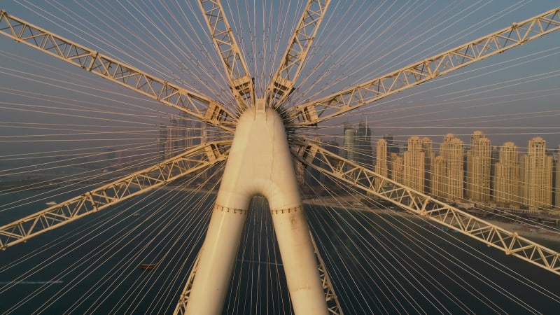 Aerial view passing by of the Ferris wheel under constructi.