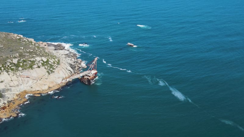 Aerial view of shipwreck crane barge is off the coast of Sandy Bay.