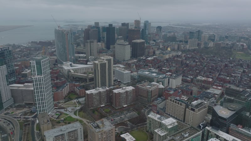 Aerial panoramic footage of Hospital complex and modern high rise downtown office buildings. Boston, USA