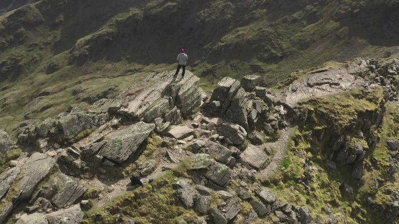 Man at the top of the mountain hill in Lake District