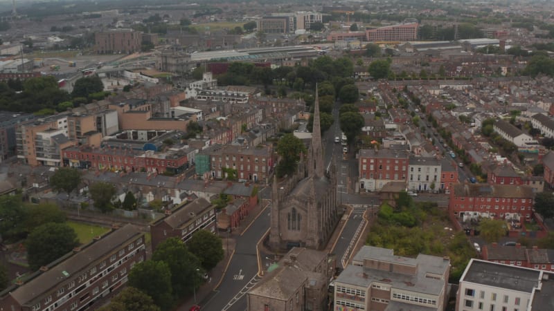 Aerial view of old religious landmark. Historic Black church between town development. Dublin, Ireland