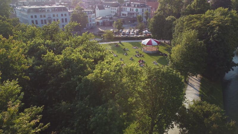 People relaxing in Park Lepeleburg on a summer day in Utrecht, the Netherlands.