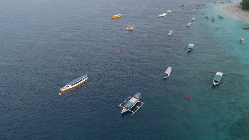 Aerial view at group of traditional boats anchored, Bali island.