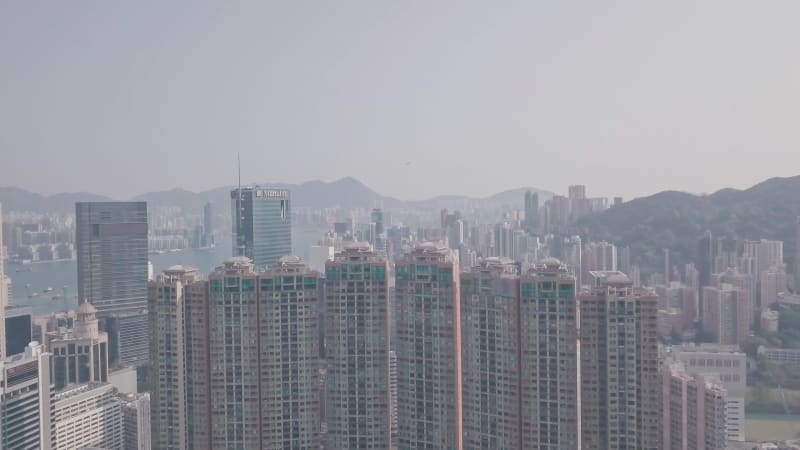 Residential buildings and skyscrapers in Happy Valley, Hong Kong. Aerial drone view