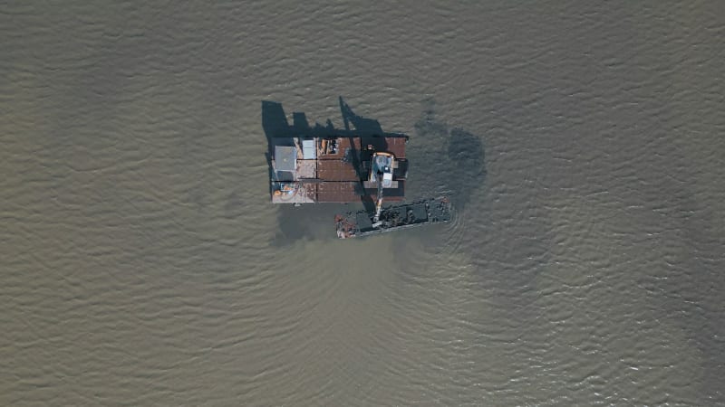 Excavator working in a lake