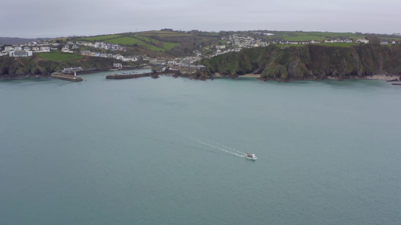 Fishing Boat Leaving Port on a Grey Overcast Day