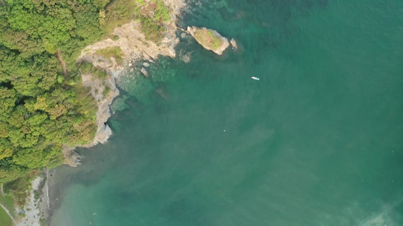 Aerial view of Polridmouth Cove at sunset, Par, Cornwall, United Kingdom.