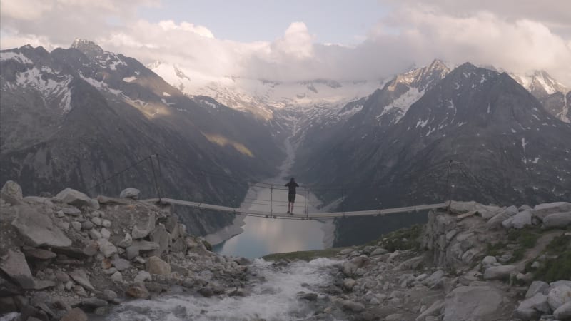 Aerial view of a person looking the Alps landscape, Italy.