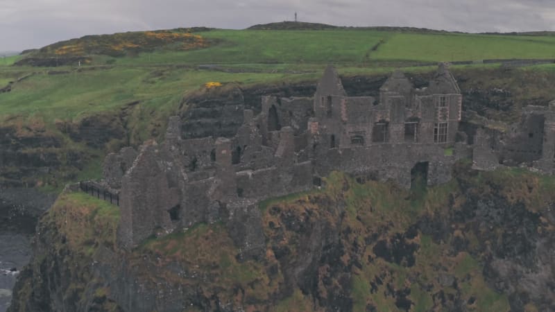 Dunluce Castle ruins on the Antrim Coast, Northern Ireland. Aerial drone view