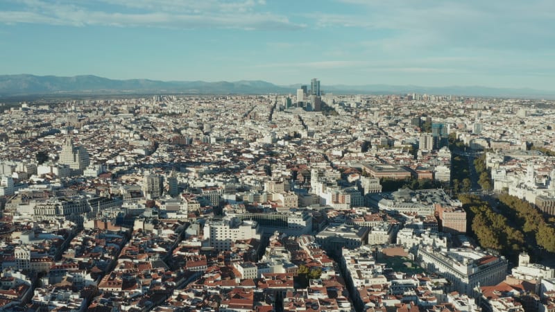 Aerial panoramic footage of large city in afternoon sunshine. Palaces in historic city centre.