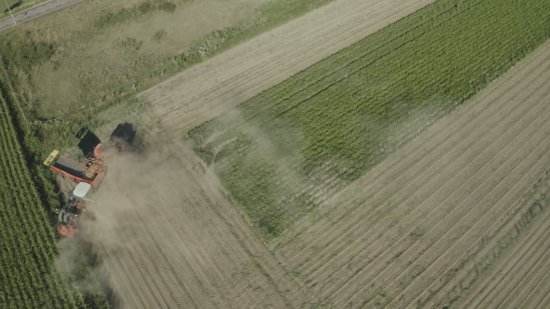 In August 2022, an aerial view captured a farmer harvesting potatoes amidst a drought in the Netherlands.