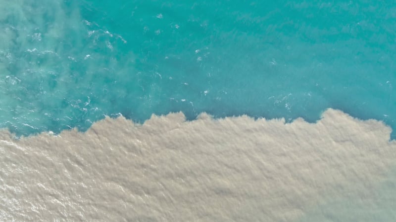 Aerial view of river and sea waters mixing in Rio.