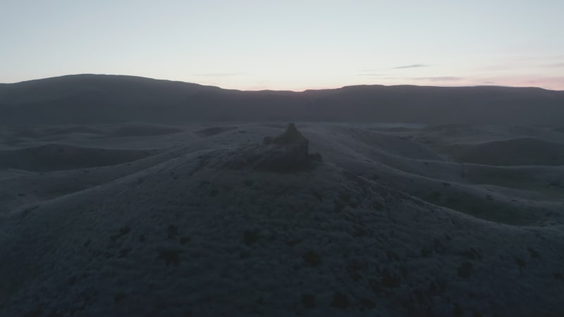 Moody drone view of foggy highlands in Iceland. Beauty on earth. Aerial view of sunset over desolate and misty icelandic countryside. Stunning moonscape wild panorama