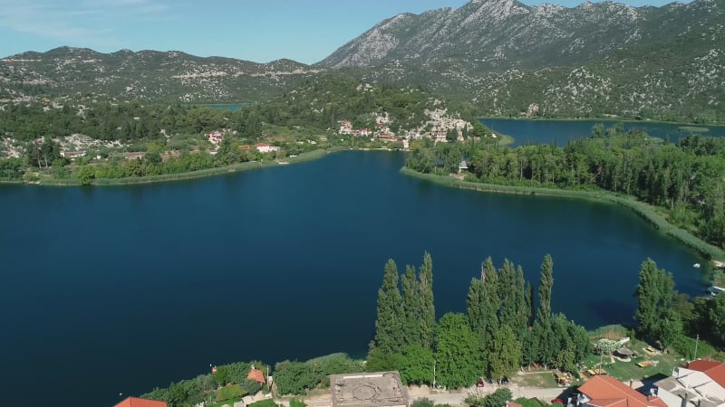 Aerial view of kitesurfing spot on the Neretva delta valley river.