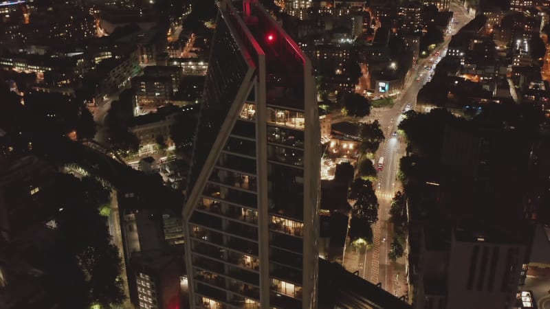 High angle view of modern design tall residential building and urban district in background. London, UK