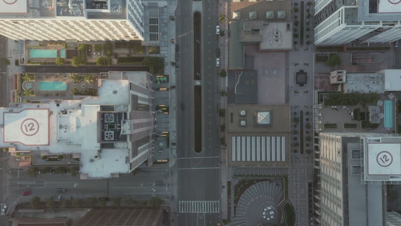 City Apartment Buildings with pools in Downtown Los Angeles, Aerial Birds Eye View tilt down wide angle shot