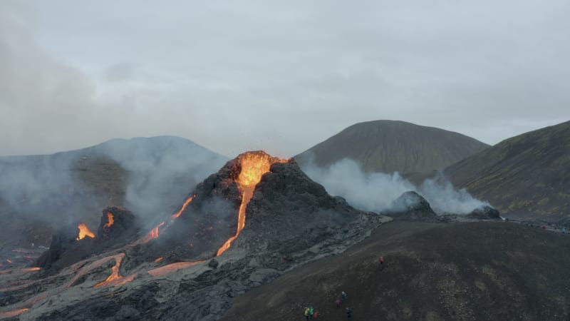 People watching strong lava eruption from Fagradalsfjall volcano in Iceland